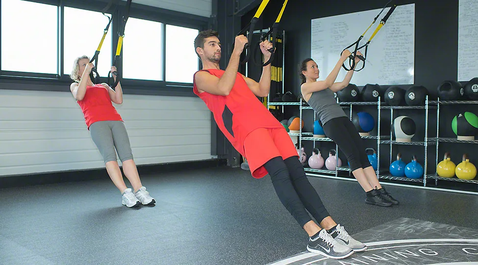 fit young people training hard at the gym – crossfit