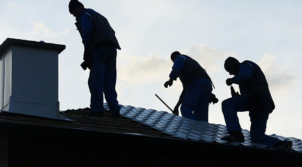 Building roof construction site teamwork