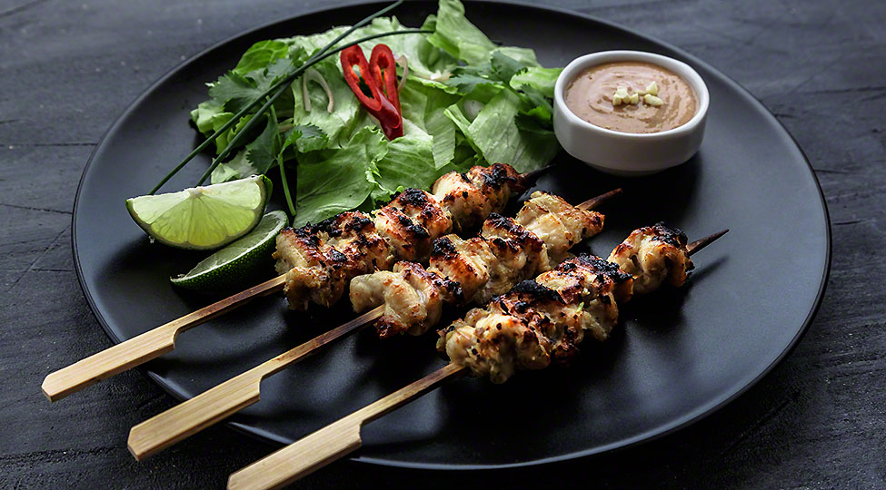 Satay is a Malaysian-style kebab. It  served with  peanut sauce, slivers of cucumbers and onions.