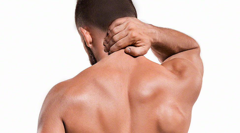 Studio shot of man with pain in neck
