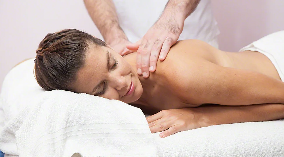 Woman receibing a massage at the spa