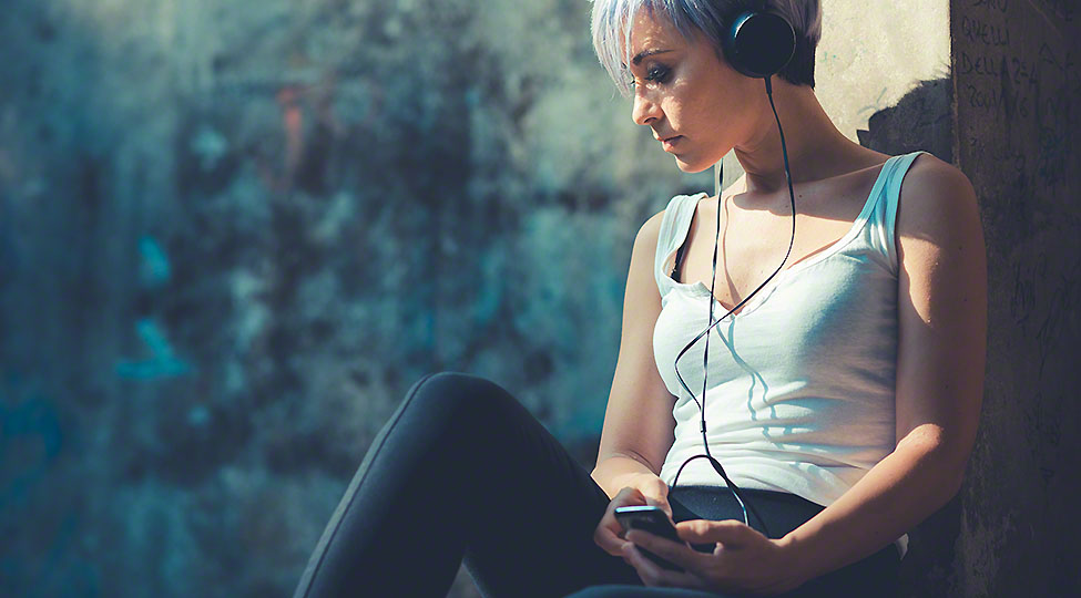young beautiful short blue hair hipster woman with headphones mu